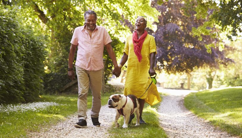 Couple walking dog 